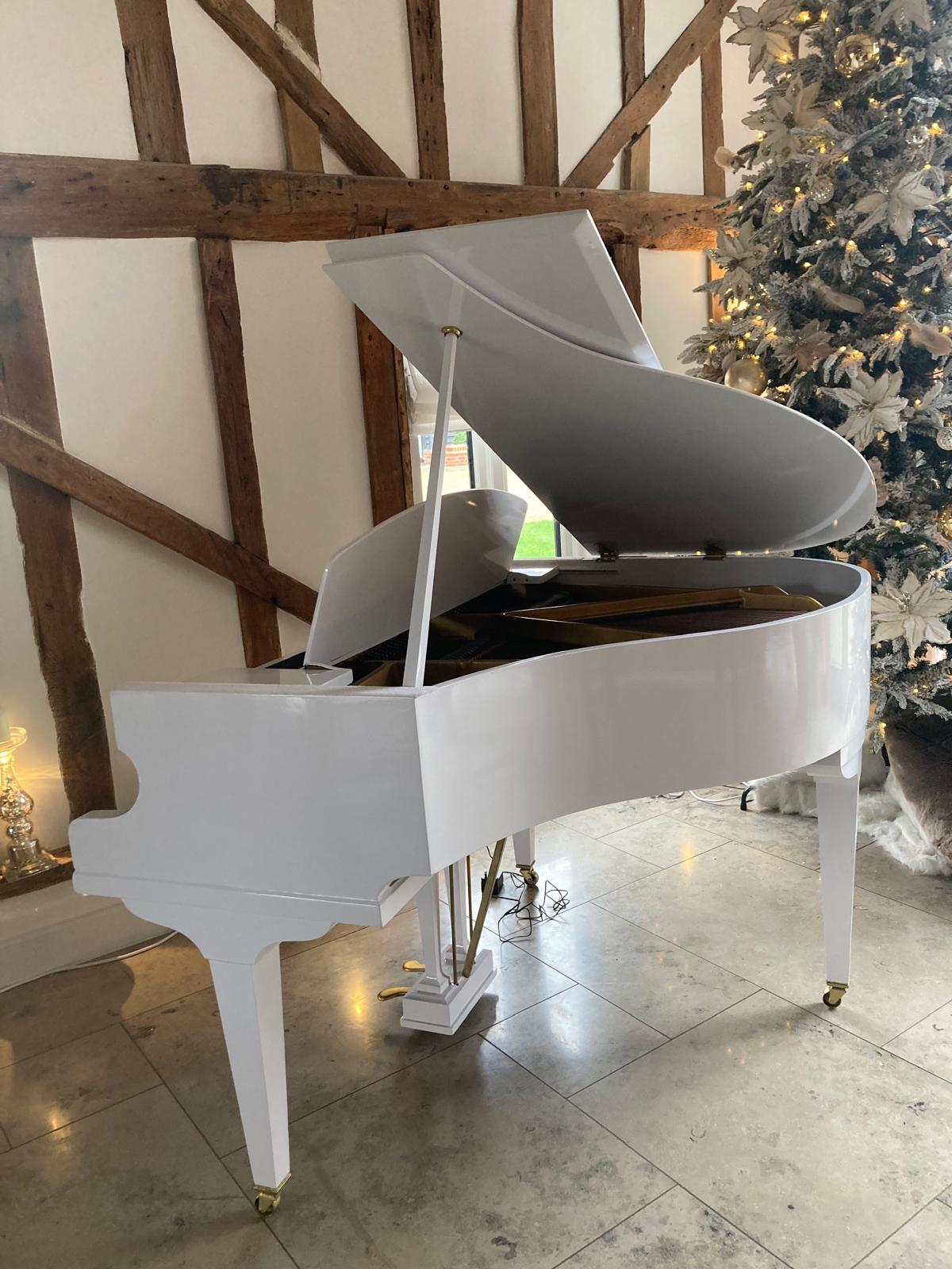 Refurbished Acoustic White Baby Grand Piano.